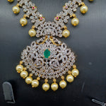 Beautiful Diamond Finish AD And Emerald Peacock Long Haram With Earrings