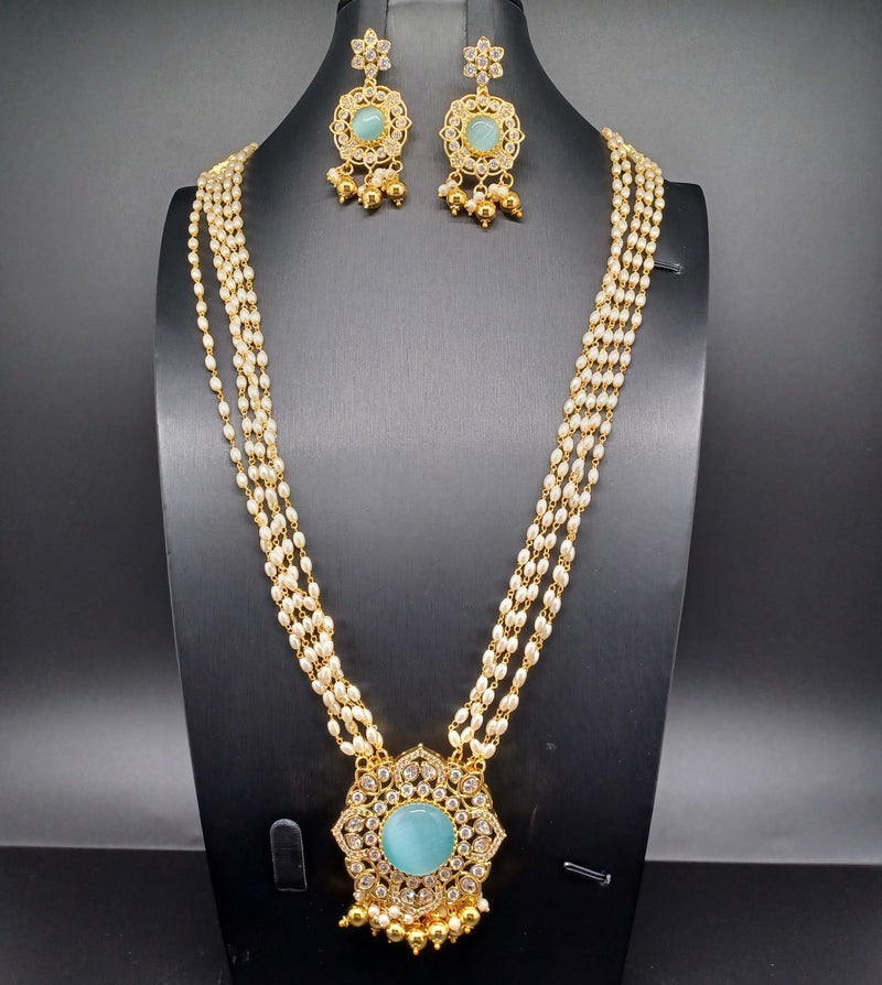 Beautiful Multi Strand Rice Pearl Set With AD And Blue Stone Locket And Earrings