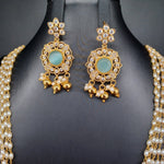 Beautiful Multi Strand Rice Pearl Set With AD And Blue Stone Locket And Earrings