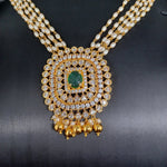 Beautiful Multi Strand Rice Pearl Set With AD And Emerald Stone Locket And Earrings