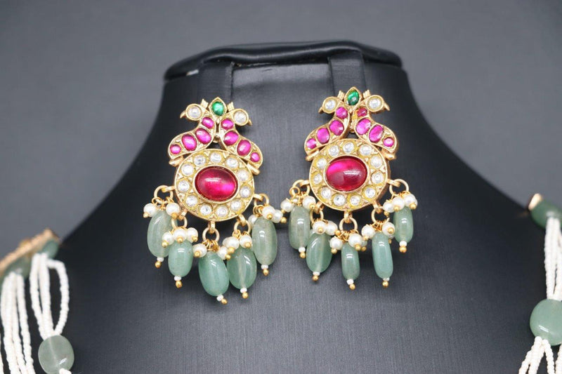 Beautiful Pastel Green And Pearl Set With multi Stone Peacock Locket And With Earrings