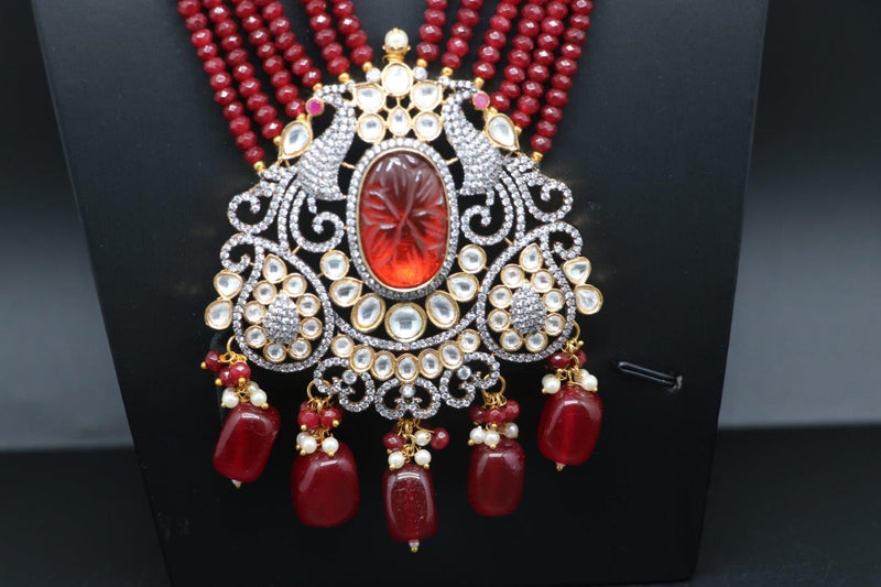 Elegant Polki Kundan And Carved Stone Pearl And Marron Color Beads Set With Earrings
